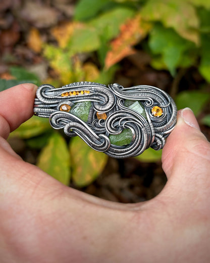 Jungle vibes // peridot // garnets // oxidized silver // festival jewelry // handmade wire art // wire wrap // pendant // flow // sexy wrap