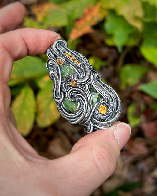 Jungle vibes // peridot // garnets // oxidized silver // festival jewelry // handmade wire art // wire wrap // pendant // flow // sexy wrap
