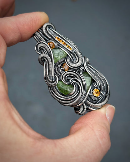 Jungle vibes // peridot // garnets // oxidized silver // festival jewelry // handmade wire art // wire wrap // pendant // flow // sexy wrap